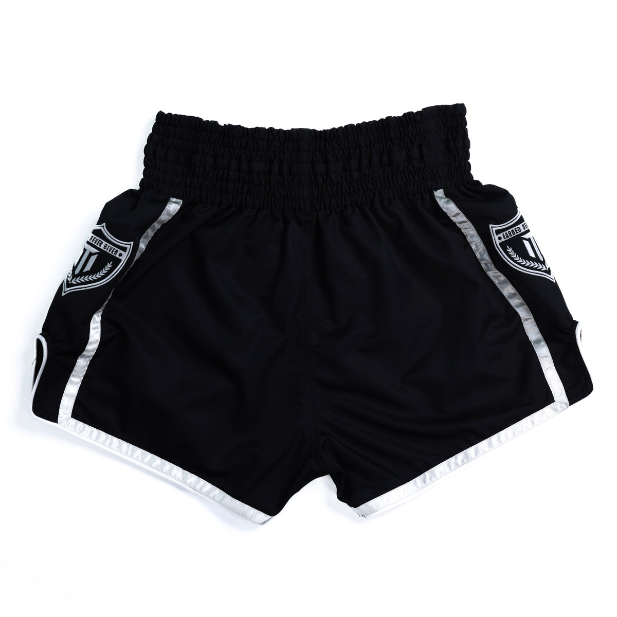 Fighter wearing MTM Essentials Muay Thai Shorts in black, side view