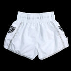 Close-up of MTM Essentials Muay Thai Shorts in white, showing fabric detail and logo