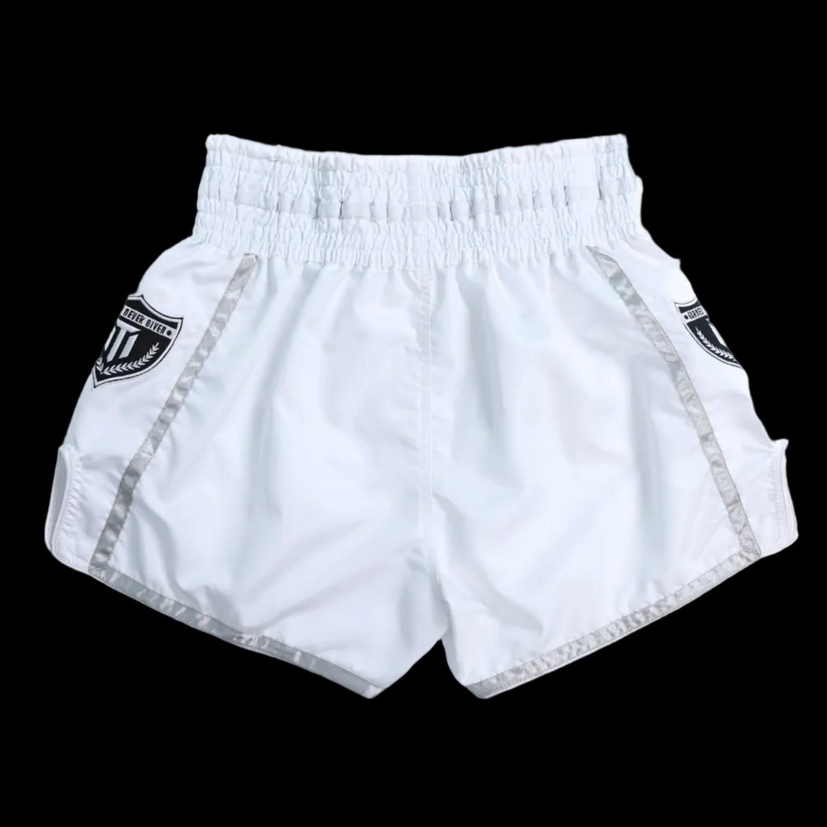 Close-up of MTM Essentials Muay Thai Shorts in white, showing fabric detail and logo
