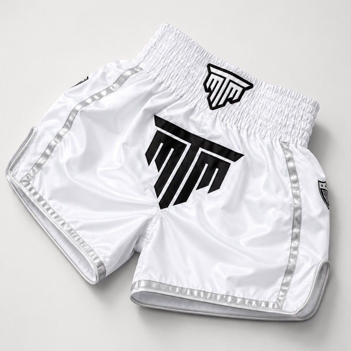 MTM Essentials Muay Thai Shorts in white, angled view
