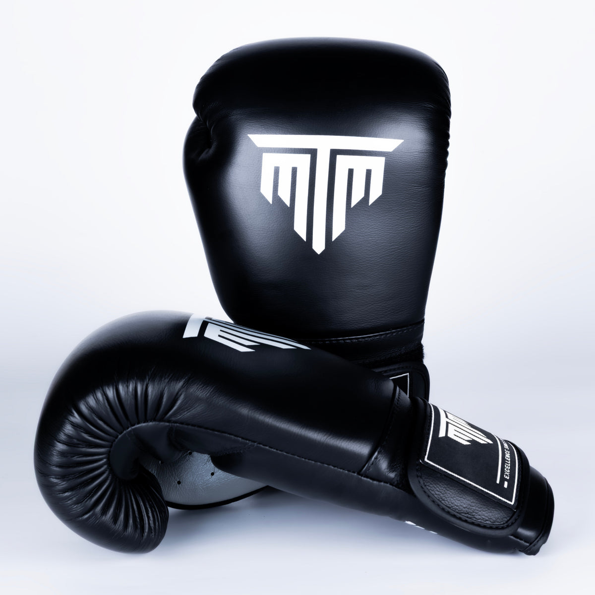 MTM Sport Pro X1 Velcro Boxing Gloves in black, showing the velcro closure