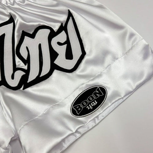 Close-up of the BOON Sport Classic Muay Thai Shorts waistband and 'Muay Thai' lettering
