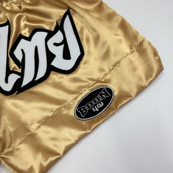 BOON Sport Gold Classic Muay Thai Shorts, detail of 'Muay Thai' lettering