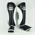 Raja Boxing Muay Thai Style Shin Guards in black and white, front view