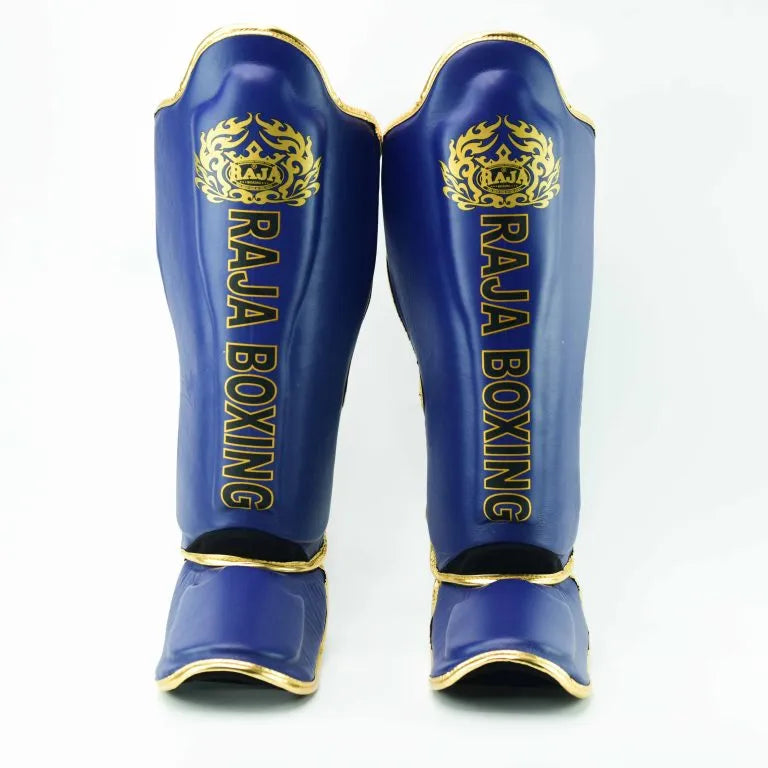 Raja Boxing LS2 Lightweight Shin Guards in blue, side view.