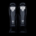 MTM Sport VX Shin Guards in black, side view on white background