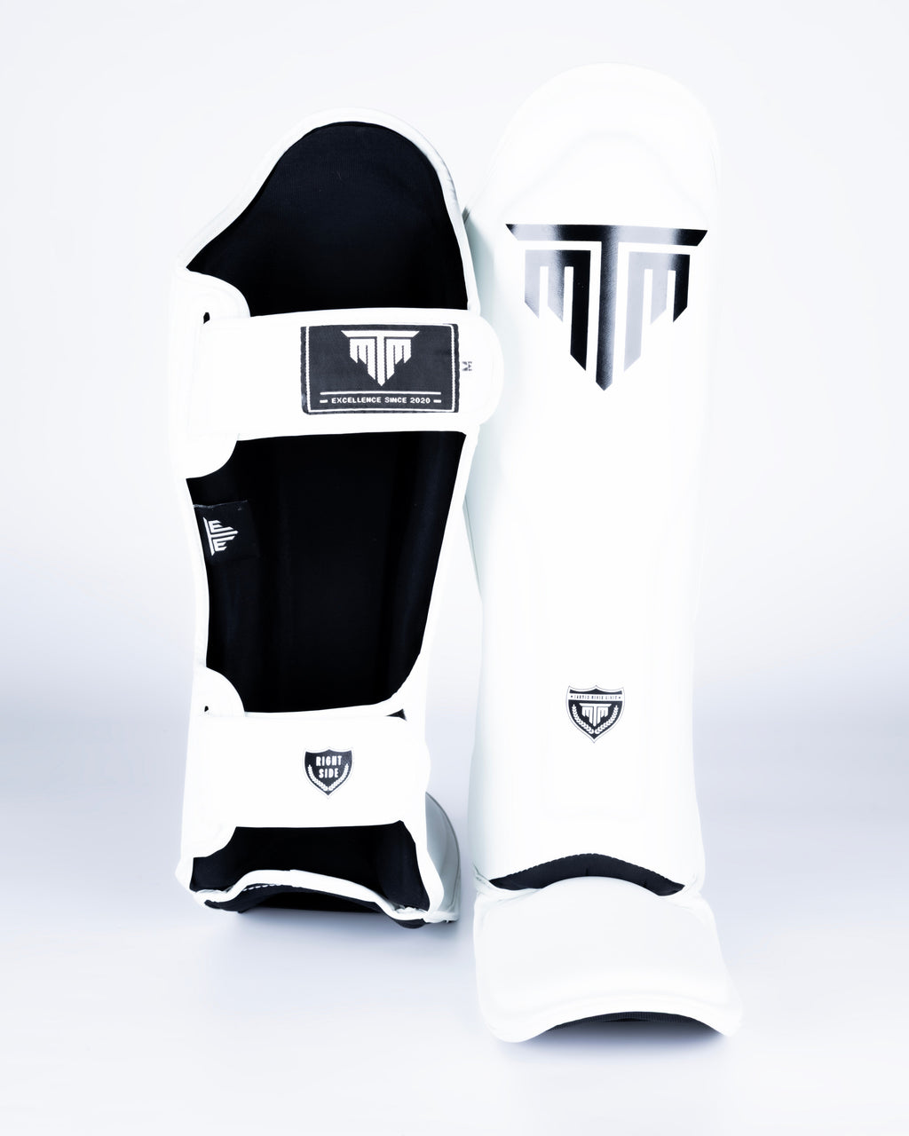 MTM Sport VX Shin Guards in white, side view showing ergonomic shape