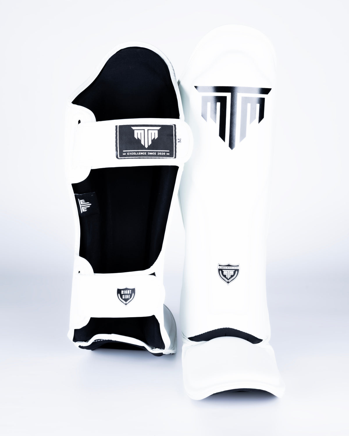 MTM Sport VX Shin Guards in white, side view showing ergonomic shape